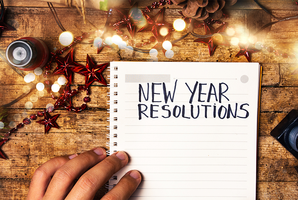 spiral notebook page titled "new year resolutions"