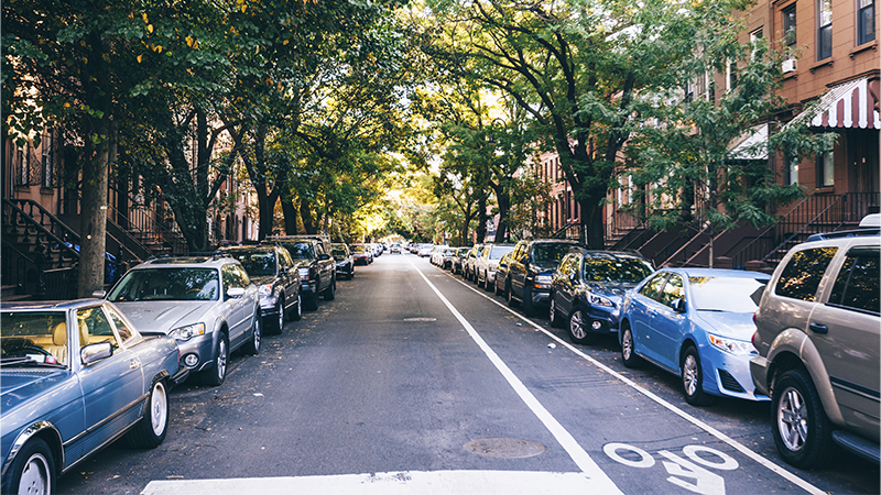 parked cars street lined with parked cars