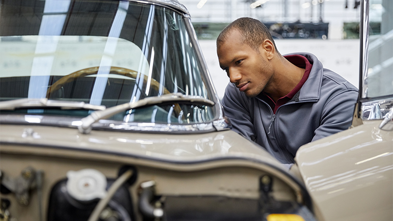 classic car inspection a man inspecting a classic car