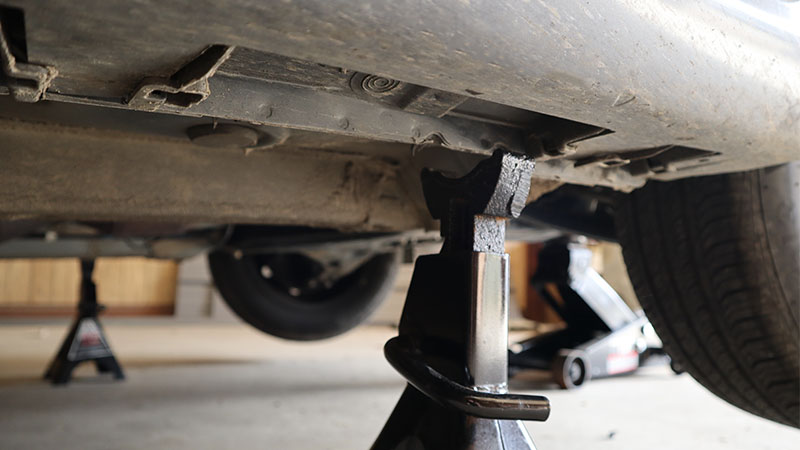 jack stands on pinch welds with the jack raising the front of the vehicle