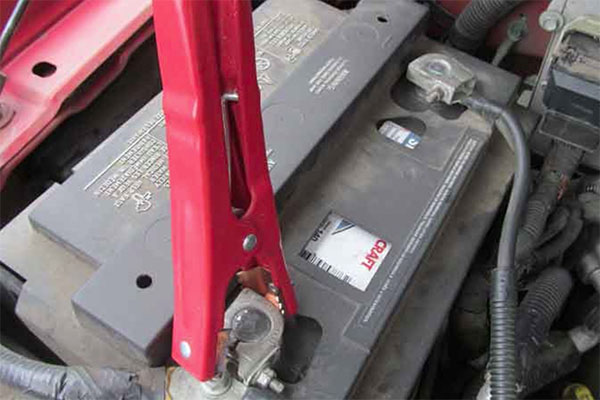 jumper cable attached to battery