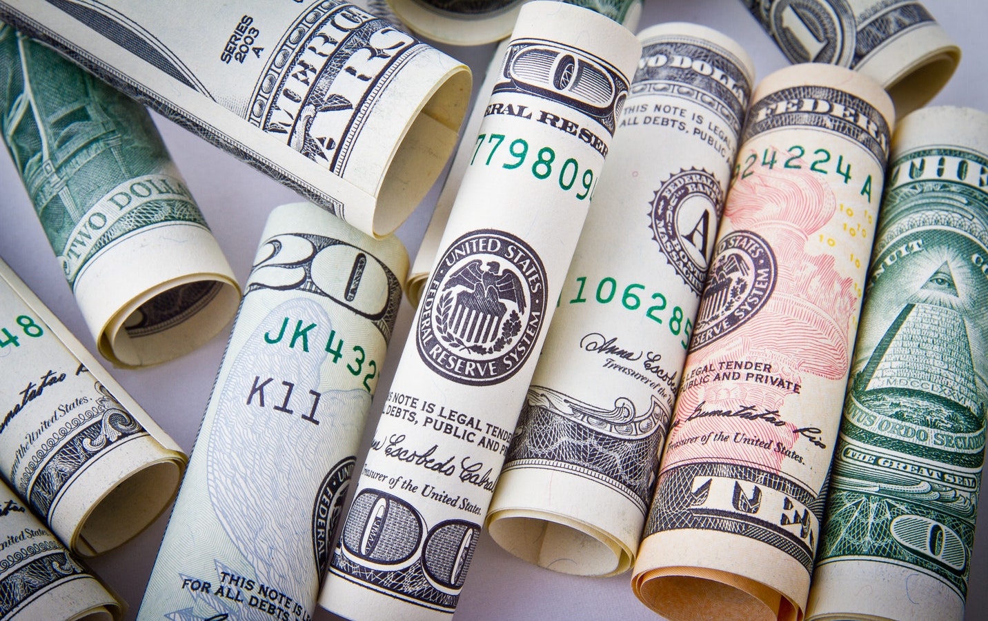 money rolled dollar bills
