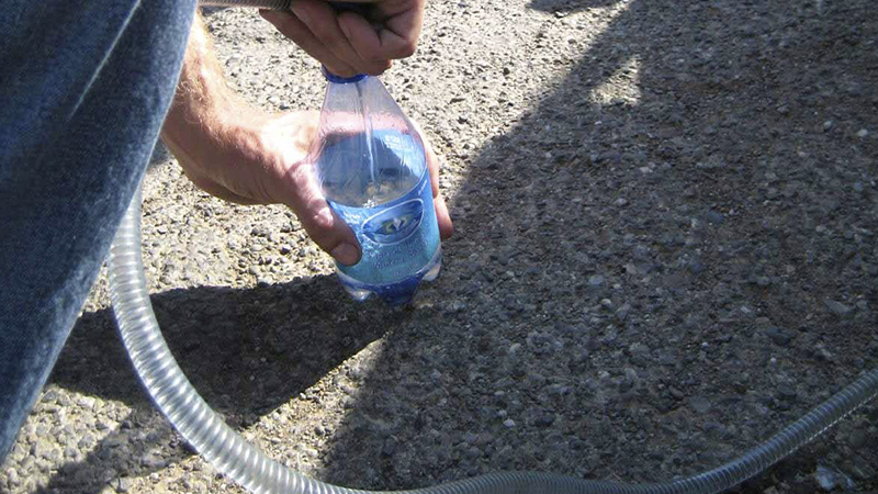 siphoning fuel siphoning fuel into a bottle