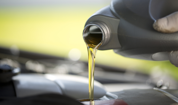 Oil being poured in to an engine