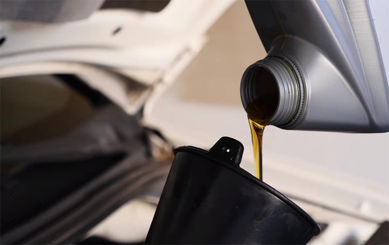 synthetic oil being poured