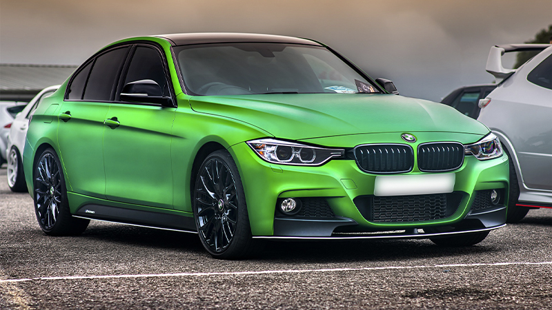 bright green metallic wrapped vehicle with tinted windows and black wheels